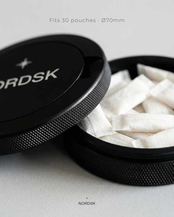 snusdosa and nicotine container with pouches in black NORDSK tin, designed in Sweden