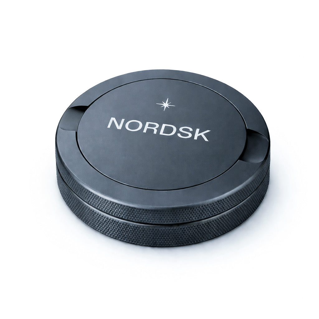 Graphite Grey metal snus tin with NORDSK branding on white background, designed in Sweden