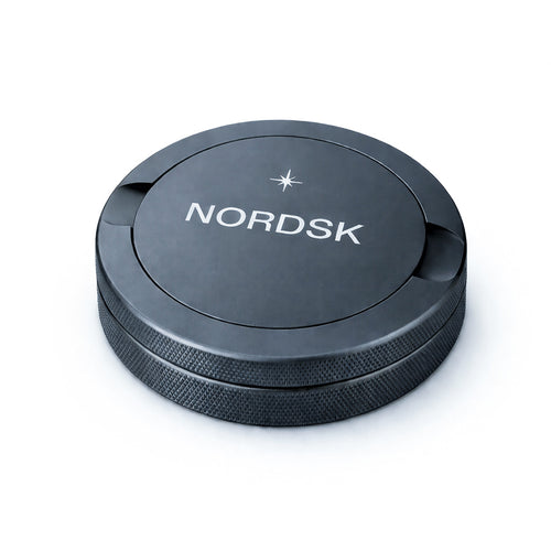 Graphite Grey metal snus tin with NORDSK branding on white background, designed in Sweden