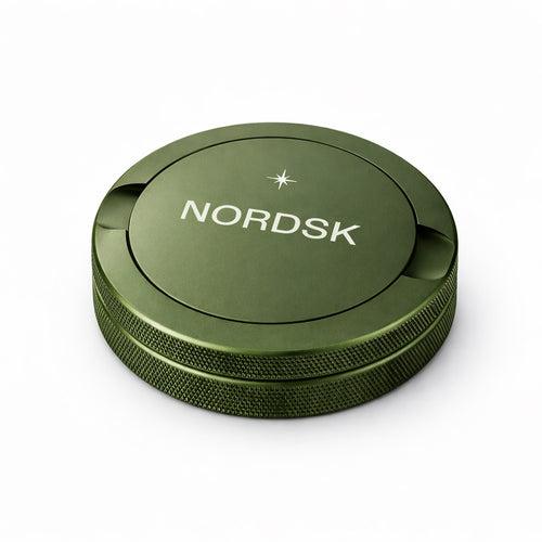 Olive Green metal snus tin with NORDSK branding on white background, designed in Sweden