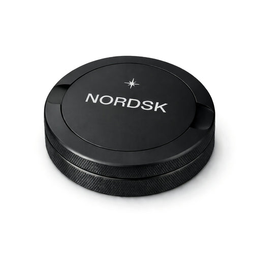 NORDSK Matte Black metal snus tin on white background, designed in Sweden